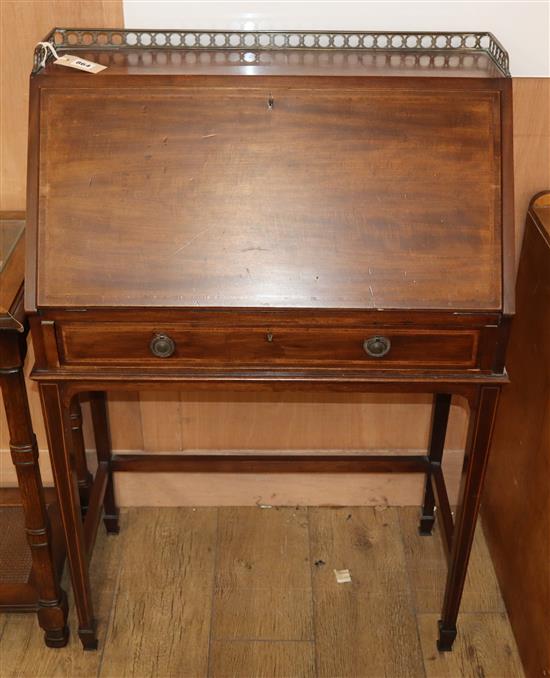 An Edwardian banded mahogany bureau, on square tapered legs W.69cm